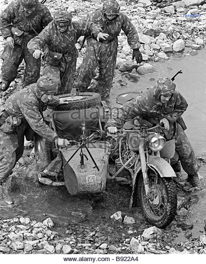 reconnaissance-men-taking-motorcycle-across-the-stream-during-exercises-b922a4.jpg